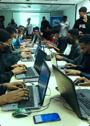 People coding together - Code In The Dark